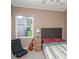 Comfortable bedroom featuring natural light, a cozy bed, and chair at 1001 57Th N Ave, St Petersburg, FL 33703