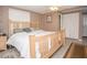Bright bedroom with light wood bed frame, a ceiling fan, and ample closet space at 1001 57Th N Ave, St Petersburg, FL 33703