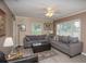 Spacious living room featuring two sofas, light wood floors, and neutral color tones at 1001 57Th N Ave, St Petersburg, FL 33703