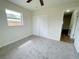 Bedroom with plush carpet, closet and window providing natural light at 1003 Cornwall Ct, Brandon, FL 33510