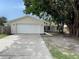 Home exterior showcasing a two-car garage and clean front facade at 1003 Cornwall Ct, Brandon, FL 33510