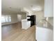 Modern kitchen with white cabinets, granite countertops, stainless steel appliances, and an open layout at 1003 Cornwall Ct, Brandon, FL 33510