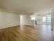 Spacious room featuring modern wood floors, and open access to the kitchen and outdoor spaces at 1003 Cornwall Ct, Brandon, FL 33510