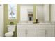 Modern bathroom with dual sinks, white cabinets, and stylish fixtures at 10113 Trumpet Honetsuckle Way, San Antonio, FL 33576