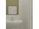 Clean and simple bathroom featuring a pedestal sink and a minimalistic design at 10113 Trumpet Honetsuckle Way, San Antonio, FL 33576