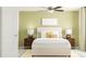 Comfortable bedroom with neutral tones, a ceiling fan, and matching bedside lamps at 10113 Trumpet Honetsuckle Way, San Antonio, FL 33576