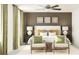Well-designed bedroom featuring a large bed, bedside tables with lamps, and decorative wall art at 10113 Trumpet Honetsuckle Way, San Antonio, FL 33576