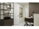 Modern office with shelving unit and a work area with a desk, chair, and decorative items at 10113 Trumpet Honetsuckle Way, San Antonio, FL 33576