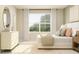 Inviting bedroom features soft decor, abundant natural light, and a soothing ambiance for restful relaxation at 10186 Trumpet Honeysuckle Way, San Antonio, FL 33576