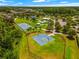 Aerial view of community amenities with pool, tennis, and basketball courts at 10707 Pegasus Valley Ct, Tampa, FL 33647