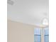 Bonus room with neutral paint and carpet features windows covered with blinds and a contemporary ceiling fan at 10707 Pegasus Valley Ct, Tampa, FL 33647