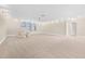 Spacious bonus room with neutral carpeting, abundant light, and a playful tent for versatile usage at 10707 Pegasus Valley Ct, Tampa, FL 33647