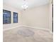 Dining room featuring tile floors, neutral walls, and a decorative rug at 10707 Pegasus Valley Ct, Tampa, FL 33647
