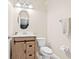 Neat half bathroom featuring a modern vanity, lighting, and stylish fixtures at 10707 Pegasus Valley Ct, Tampa, FL 33647