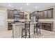Modern kitchen boasts granite countertops, dark wood cabinets, and stainless steel appliances at 10707 Pegasus Valley Ct, Tampa, FL 33647