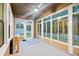 The lanai features a screened enclosure and concrete flooring overlooking the backyard at 10707 Pegasus Valley Ct, Tampa, FL 33647