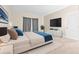 Relaxing main bedroom with a TV, soft carpet, and natural light from the window at 10707 Pegasus Valley Ct, Tampa, FL 33647