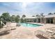 Inviting community pool with ample seating and a covered pavilion for relaxing at 10707 Pegasus Valley Ct, Tampa, FL 33647