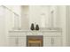 Bathroom with double vanity, granite countertop, and modern fixtures for a luxurious feel at 10844 Fowlers Bluff Ct, Tampa, FL 33647