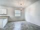 Bright dining room features modern light fixture and large window at 11100 Balfour St, Venice, FL 34293