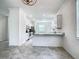 Clean, bright kitchen with white cabinets, granite countertops, and stainless-steel appliances at 11100 Balfour St, Venice, FL 34293