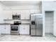 Kitchen boasts stainless steel appliances and ample cabinet space at 11100 Balfour St, Venice, FL 34293