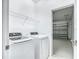 Bright laundry room with new appliances and convenient access to the garage at 11100 Balfour St, Venice, FL 34293