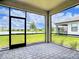 Screened patio with stunning water view and decorative stone pavers at 11100 Balfour St, Venice, FL 34293