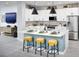 Modern kitchen with white cabinets, a large center island, and stainless steel appliances at 11313 Hardwood Hammock Ln, Riverview, FL 33569