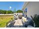 Patio area with grill and outdoor furniture, offering a perfect space for relaxation at 11313 Hardwood Hammock Ln, Riverview, FL 33569