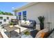 A cozy patio setting with a grill, seating area, and stylish planters at 11313 Hardwood Hammock Ln, Riverview, FL 33569
