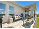 Outdoor patio area with stone flooring and comfortable seating for relaxing outdoors at 11313 Hardwood Hammock Ln, Riverview, FL 33569