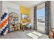 Bright and inviting study with a desk, modern decor, and large windows for natural light at 11313 Hardwood Hammock Ln, Riverview, FL 33569