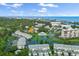 Breathtaking aerial view of a waterfront community, showcasing lush landscaping, serene lake, and coastal access at 11510 Shipwatch Dr # 1372, Largo, FL 33774