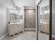 Bright bathroom with double vanity, granite countertop, and walk-in shower at 11510 Shipwatch Dr # 1372, Largo, FL 33774