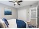 This bedroom features a ceiling fan, closet, and an attached bathroom with a small accent on the wall at 11510 Shipwatch Dr # 1372, Largo, FL 33774