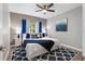 This bedroom features a ceiling fan, beautiful decor, and lots of natural light at 11510 Shipwatch Dr # 1372, Largo, FL 33774