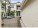 Inviting front entry featuring a private gravel patio with bench seating at 11510 Shipwatch Dr # 1372, Largo, FL 33774
