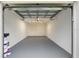 This garage has been well maintained and freshly painted with a modern gray floor at 11510 Shipwatch Dr # 1372, Largo, FL 33774