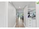 Bright hallway with views of living room and kitchen at 11510 Shipwatch Dr # 1372, Largo, FL 33774