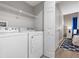 An image of the laundry room showing the washer and dryer next to the Primary bedroom at 11510 Shipwatch Dr # 1372, Largo, FL 33774