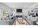 Bright living room with fireplace, comfortable seating, and access to the backyard at 11510 Shipwatch Dr # 1372, Largo, FL 33774