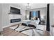 Comfortable main bedroom featuring modern fireplace, a decorative rug, and custom lighting at 11510 Shipwatch Dr # 1372, Largo, FL 33774