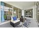 Relaxing patio view with comfortable seating and a glimpse into the interior through sliding glass doors at 11510 Shipwatch Dr # 1372, Largo, FL 33774
