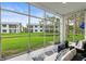 A cozy patio view with seating and a view of the well-maintained lawn and adjacent buildings at 11510 Shipwatch Dr # 1372, Largo, FL 33774