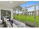 A spacious patio overlooking the lawn, providing a relaxing view and ample natural light at 11510 Shipwatch Dr # 1372, Largo, FL 33774