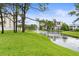 Scenic view of a pond with a fountain, surrounded by lush greenery and buildings at 11510 Shipwatch Dr # 1372, Largo, FL 33774