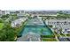 Enjoy the outdoors with tennis and pickleball courts amid lush landscaping and community buildings at 11510 Shipwatch Dr # 1372, Largo, FL 33774