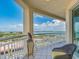 Balcony with a scenic view of the bay and a comfortable wicker chair at 1170 Gulf Blvd # 1006, Clearwater Beach, FL 33767
