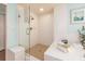 Bright bathroom featuring a glass enclosed shower at 1170 Gulf Blvd # 1006, Clearwater Beach, FL 33767